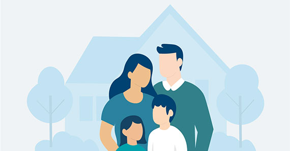 Family of four in front of a home