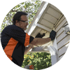 Man checking soffit openings